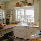 green and white cottage kitchen with Kohler's Gilford utility sink - Belstone via Atticmag