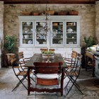 unfitted stone house kitchen with a white hutch - Elle Décor via Atticmag