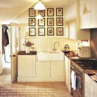 off center faucet in a white kitchen with a double farm sink - Traditional Home via Atticmag