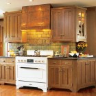 copper hood - Arts and Crafts Crown Point oak cabinets with copper hood and Heartland range - Crown Point via Atticmag