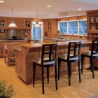 mission style kitchen - natural oak kitchen with Mission style cabinets and counters in a beach house - Hutker Architects via Atticmag