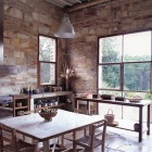 modern kitchen with stone walls in Argentina - WOI via Atticmag