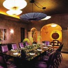 elegant dining room with clustering of multiple umbrella chandeliers - AD via Atticmag