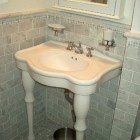 gray marble bathroom - classic gray tiled NYC apartment bathroom renovation - Atticmag