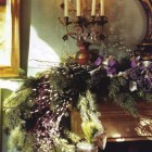 lavish christmas mantel by William Yeoward with purple ribbon - town and country via atticmag