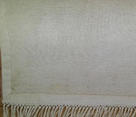 dec-rugs-sniff3-435 sniff test - tufted rug foundation fabric folded back and attached to the backing cloth - area rug facts via Atticmag