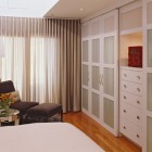 sliding door closet - on a built-in bedroom closet wall - Applegate Tran via Atticmag