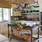 patterned tile backsplashes - hand-painted tile backsplash in rustic browns and blues - House Beautiful via Atticmag