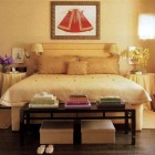 Textile designer Gretchen Bellinger's yellow bedroom with red accent - ElleDecor via Atticmag