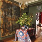 draped table - Anatolian rug drapes a rectangular foyer table in a Paris apartment - Elle Décor via Atticmag