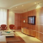 modern media walls - flat screen TV on a wood paneled wall by Pepe Calderin via Atticmag