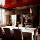 orange decor - dining room with red-orange lacquered ceiling and orange and white upholstery - House and Garden via Atticmag