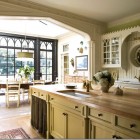 Gothic revival kitchen - white kitchen with exceptional Tudor and Gothic cabinet details - Eric J. Smith via Atticmag