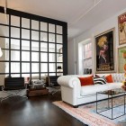 mirrored wall - faux loft window grid made with hanging mirrors by Amy Beth Cupp Dragoo - ABCD Design via Atticmag