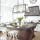 crossbuck kitchens - white kitchen with dark wood crossbuck motif island - house beautiful via atticmag