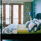 blue and green bedrooms - master bedroom with turquoise walls and green accents by Hamilton Design Associates via Atticmag