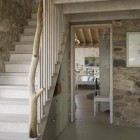 stairway with tree branch decor banister - knickerbocker group via atticmag