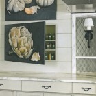 spice cabinet concealed by a hand painted canvas door - Pursley Dixon Architecture via atticmag