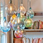 hand blown bottle pendant lights by Cisco Home - via atticmag