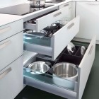kitchen cabinet lighting - Illuminated pot and pan drawers in Leicht kitchen cabinets - leicht contracts via Atticmag