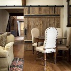 natural interior barn doors - wood plank and wrought iron sliding interior barn door - Francie Hargrove via Atticmag