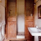 Chinese interior barn doors - used to frame the shower in a master bath - House & Garden via Atticmag