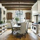 kitchen dining tables - white kitchen with trestle table and white upholstered chairs - atlanta home magazine via atticmag
