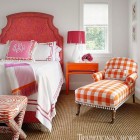 mixed prints - red, orange and pink mixed prints in a guest bedroom - Traditional Home via Atticmag