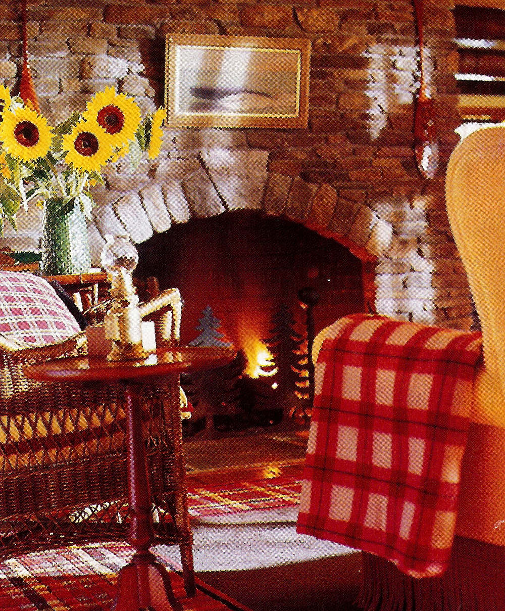 fishing camp - sitting room with traditional Adirondack stone fireplace - Country Living via Atticmag