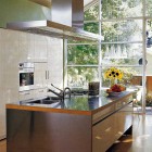 glass wall kitchen - Chicago townhouse kitchen with full glass wall - Met Home via Atticmag