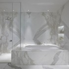 white marble bathroom - tub and shower wall of statuario veneto minimalist bath - Todhunter Earle Interiors via Atticmag